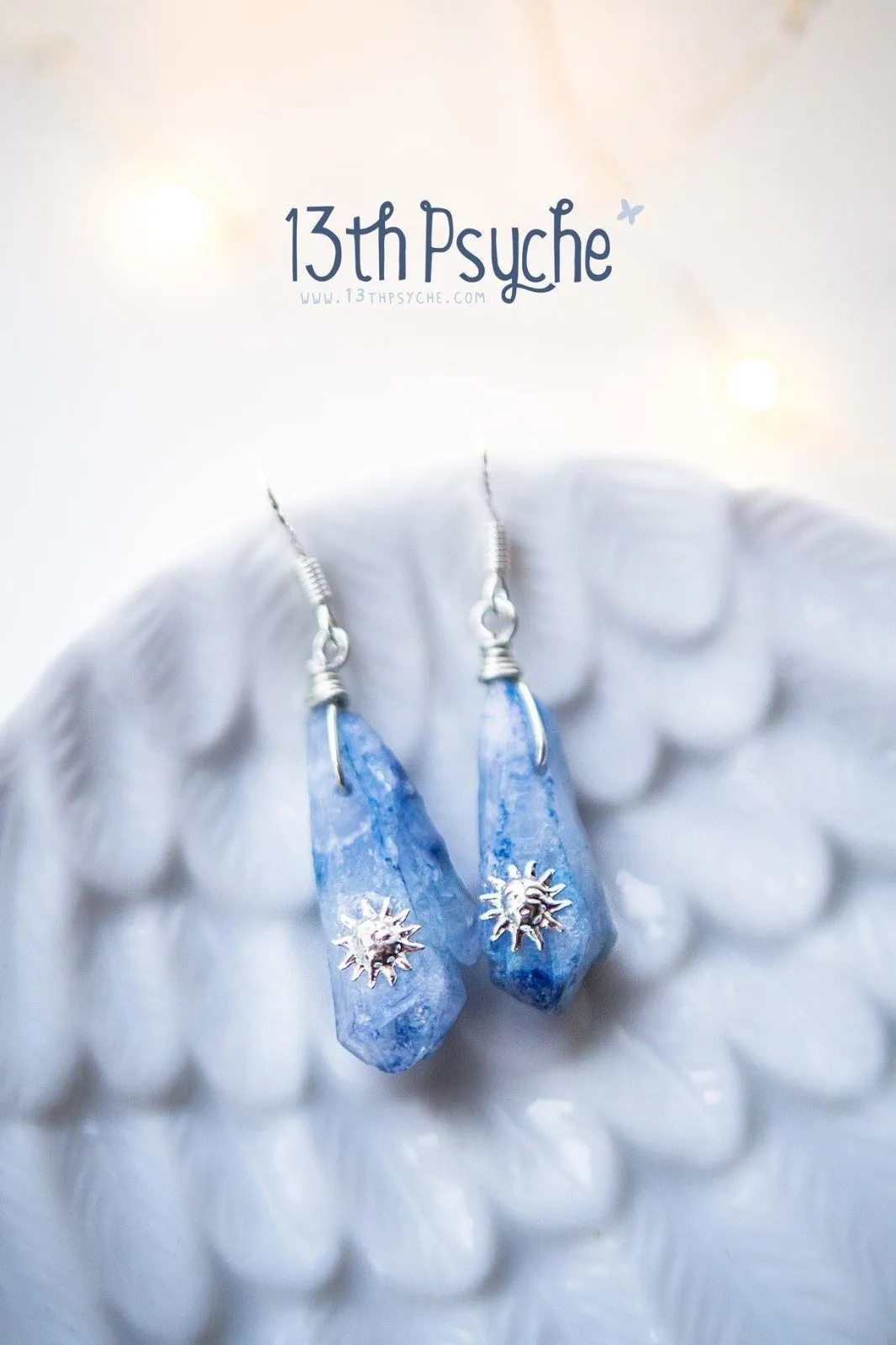 Blue raw crystal earrings with suns