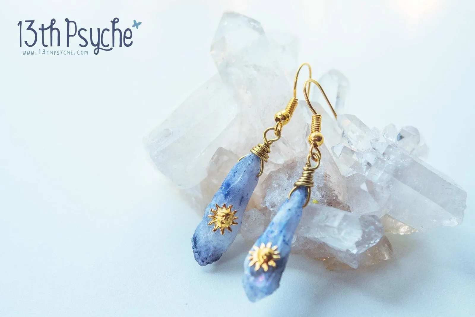 Blue raw crystal earrings with suns