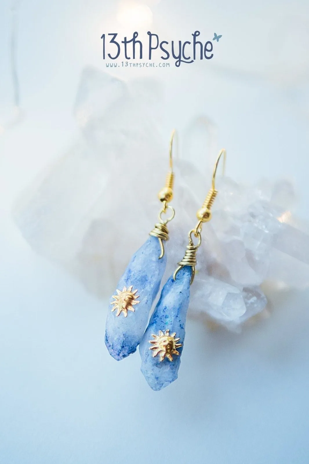 Blue raw crystal earrings with suns