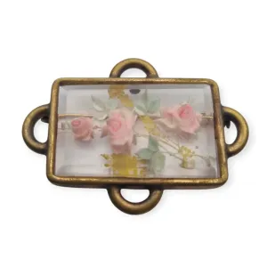 Vintage rectangular Art Deco brooch with lucite flowers from the 1940s.